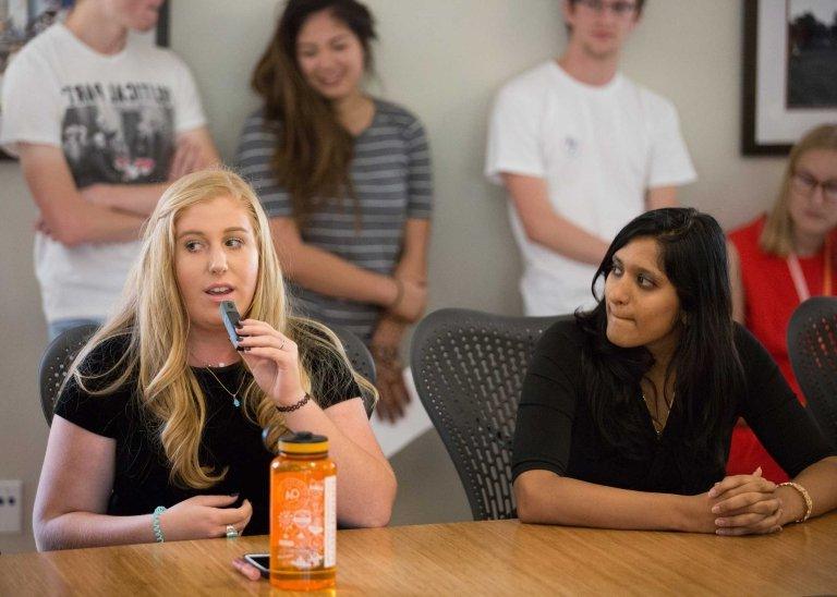 a student speaks during a student senate session